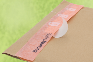 Paper Tape on Liner on a paper envelope on green background