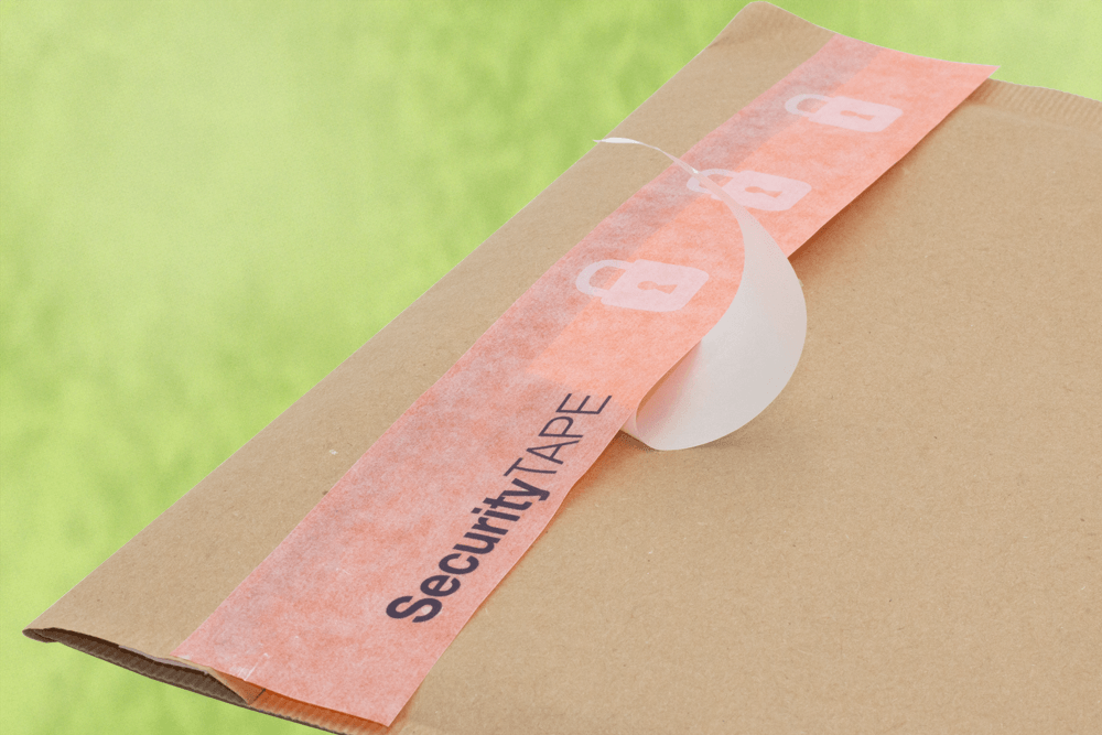 Paper Tape on Liner on a paper envelope on green background